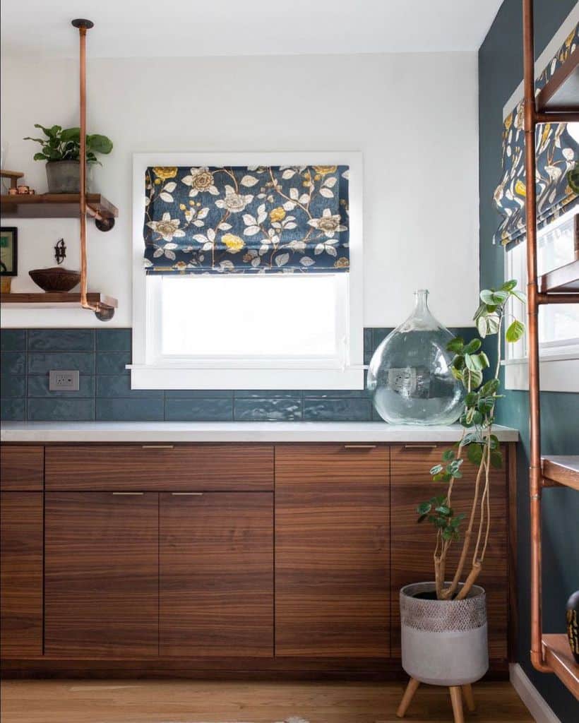 stylish kitchen with wood cabinets blue subway tiles and cooper shelves