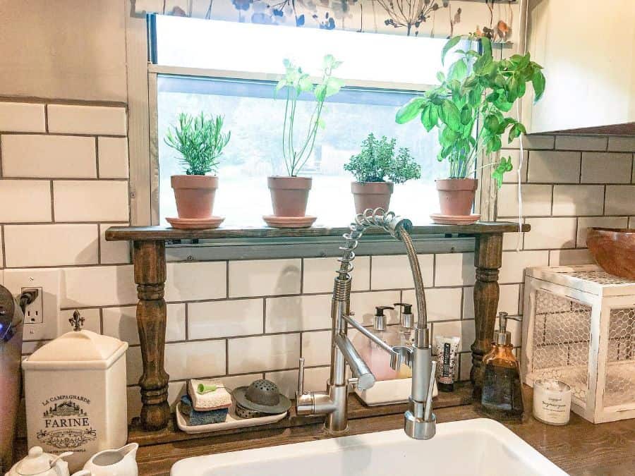 unique bedpost kitchen shelf with plants in terracotta pots