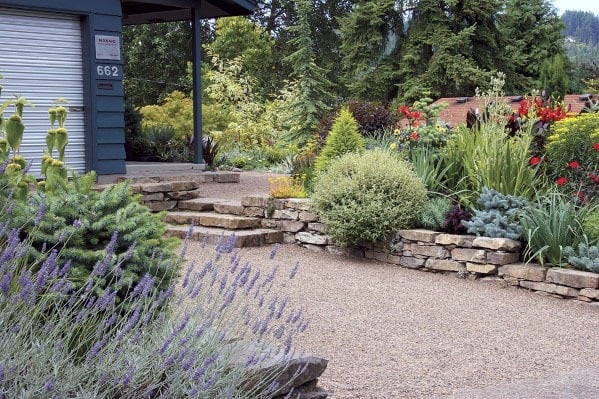 muted color scheme driveway plant landscape 