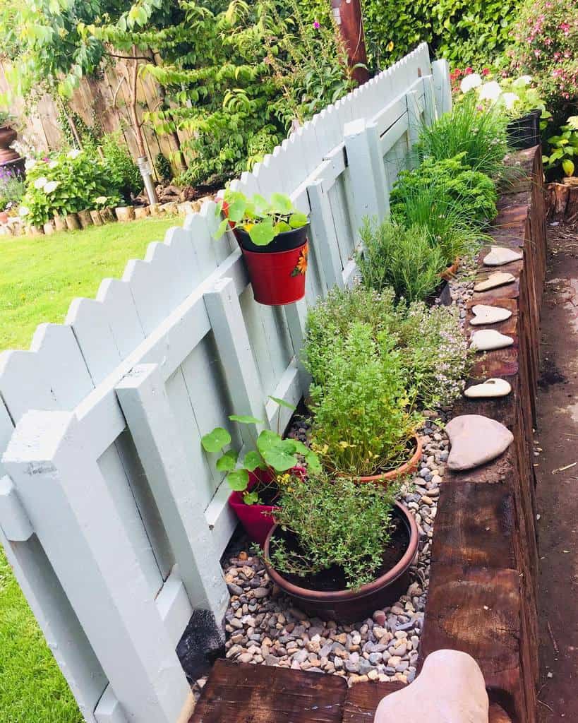 white picket fence planter herb garden