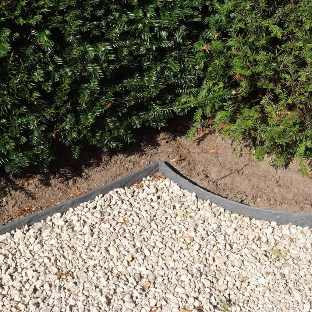 plastic garden edging white stones green plants
