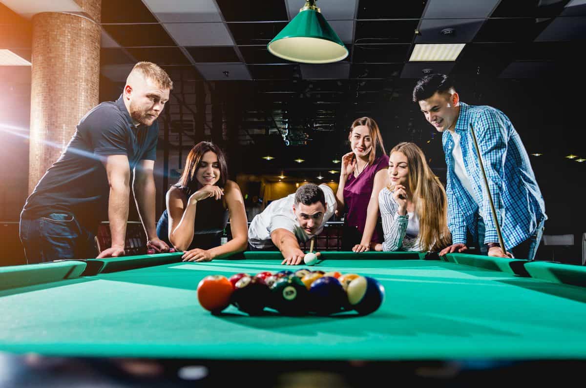 Group,Of,Young,Cheerful,Friends,Playing,Billiards.,Funny,Time,After