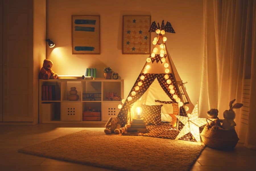 small playroom with teepee tent and storage