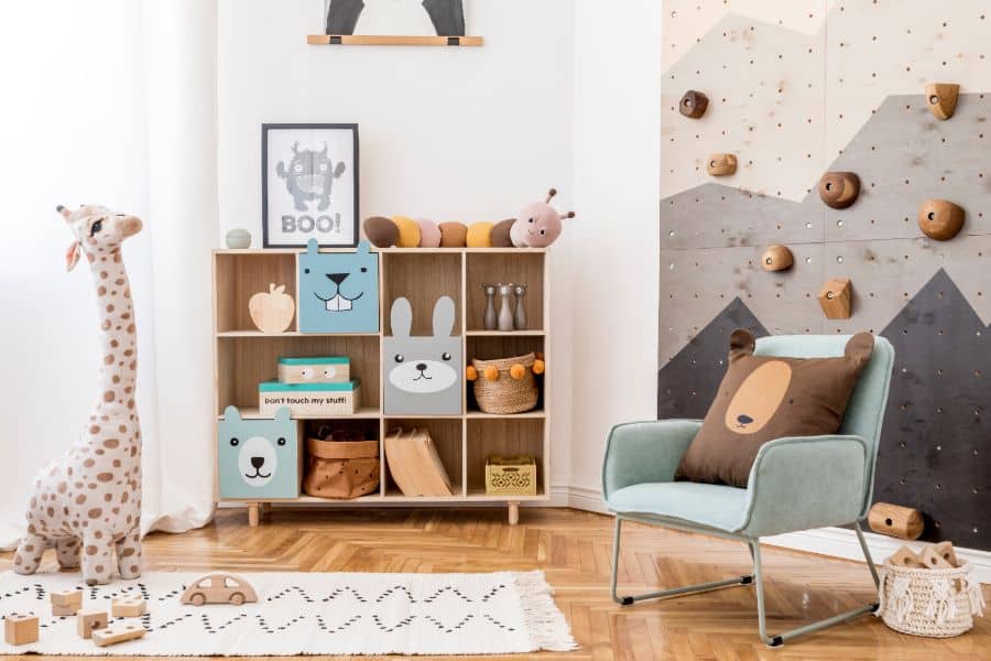 kids playroom with climbing wall and blue accent chair