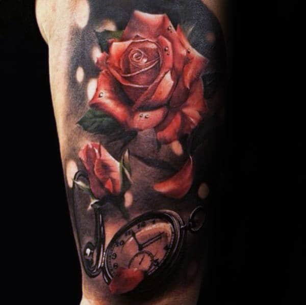 Tattoo of a realistic rose and a vintage pocket watch on an arm