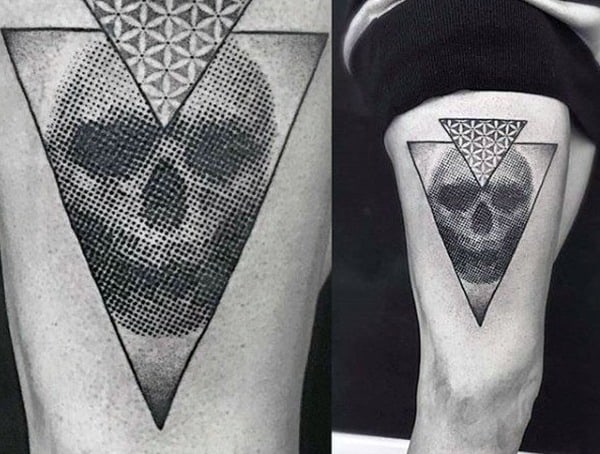Dotwork geometric tattoo featuring a skull within a triangle, using intricate shading and a honeycomb pattern for a modern, abstract effect.
