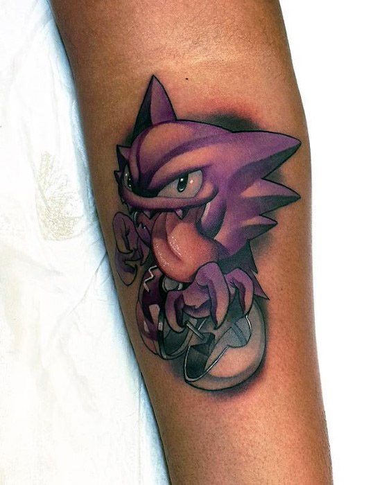 Bold Haunter tattoo gripping a Pokeball, featuring vivid purples, sharp shadows, and a dynamic pose for a striking forearm design.