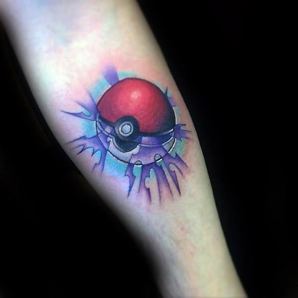 Pokeball tattoo with a cracked effect and glowing purple energy burst, blending bold color and dynamic shading on the forearm.