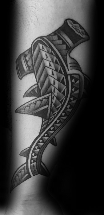 Polynesian hammerhead shark tattoo on forearm with clean geometric tribal patterns symbolizing strength, protection, and clarity.