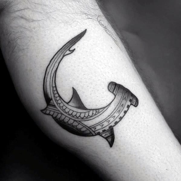 Minimalist Polynesian hammerhead shark tattoo with clean tribal lines symbolizing guidance, strength, and spiritual protection.