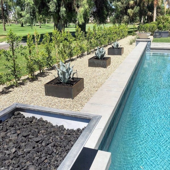 succulent planter boxes around pool 