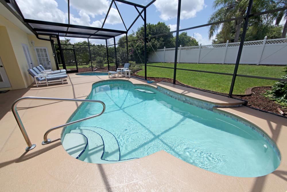 enclosed pool patio glass walls pool recliners 