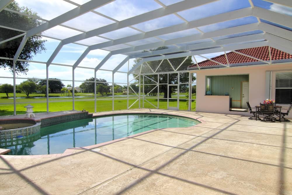 pool enclosed patio glass windows and roof