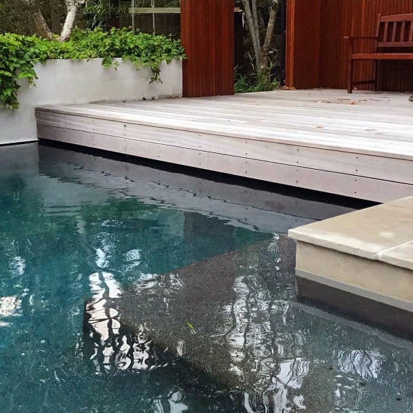 Pool With Floating Wood Deck Ideas