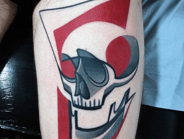 Abstract tattoo of a stylized skull with bold black outlines, geometric shapes, and red accents for a modern and dynamic design.