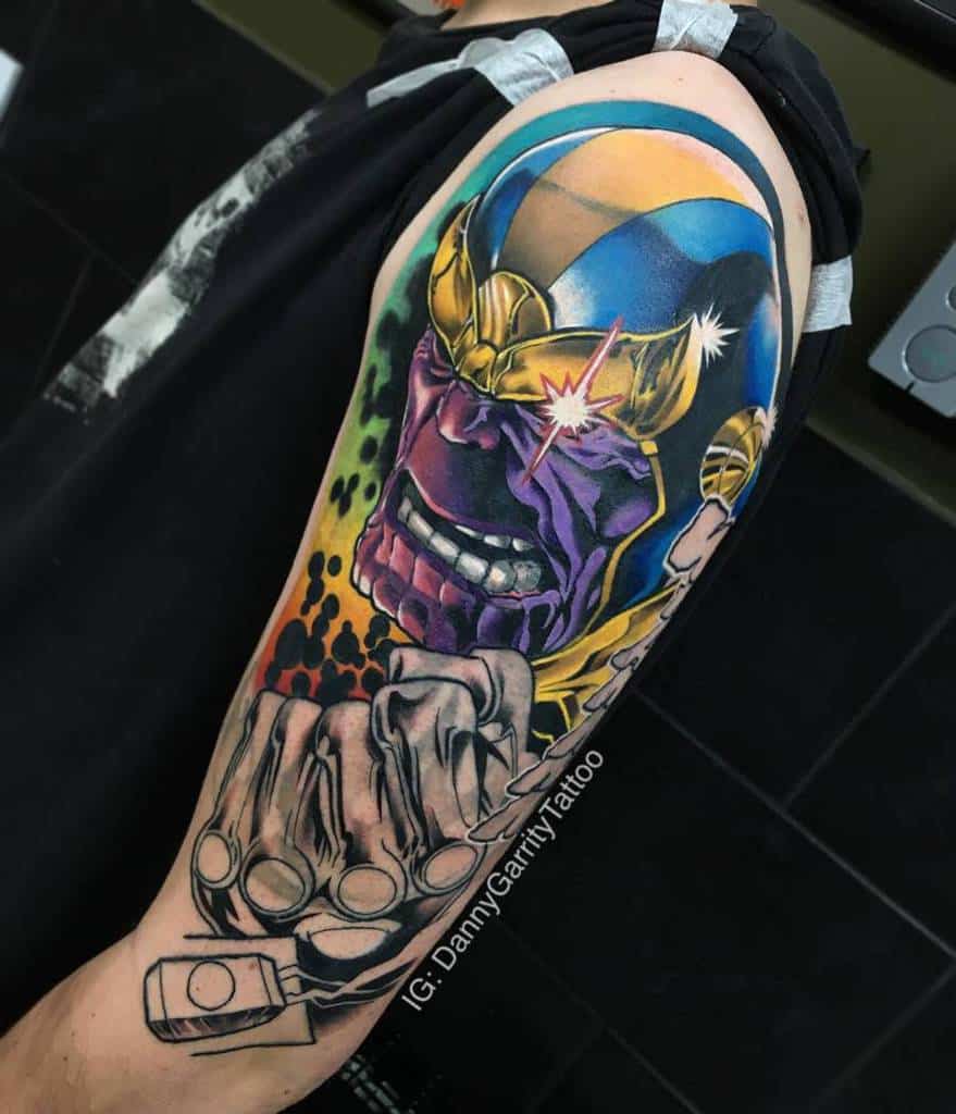 A vibrant, comic-style Thanos tattoo featuring bold colors, intense shading, and the Infinity Gauntlet in a dynamic pose