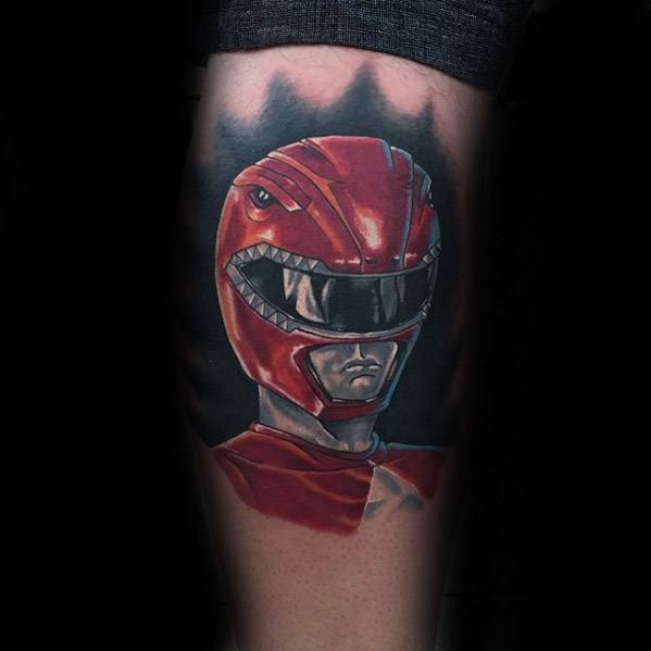 Hyper-realistic Red Ranger tattoo with lifelike lighting, reflective helmet detail, and a dark gradient background on the forearm.