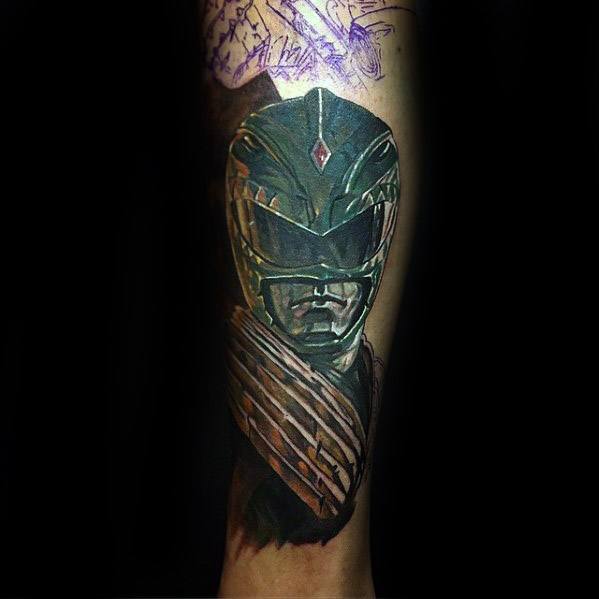 Realistic Green Ranger tattoo with deep shadows, reflective green armor, and intricate gold detailing on the chest and helmet.