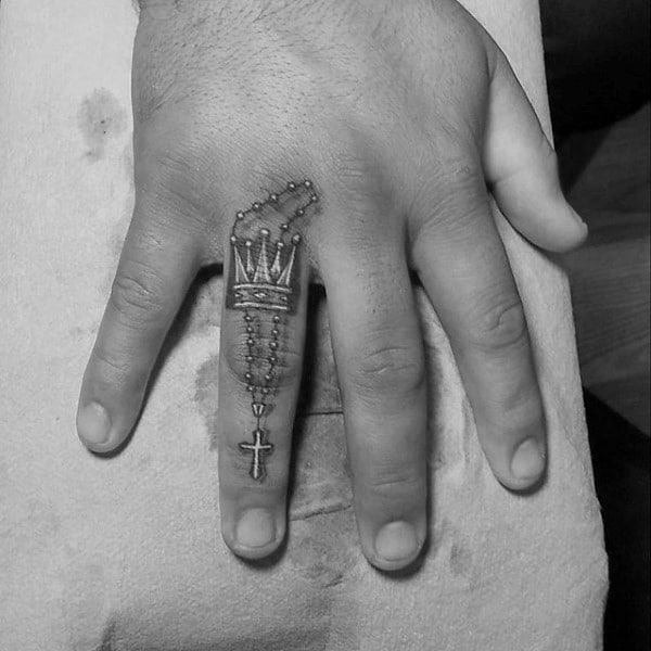 Pretty Cross Chain And Crown Tattoo On Finger