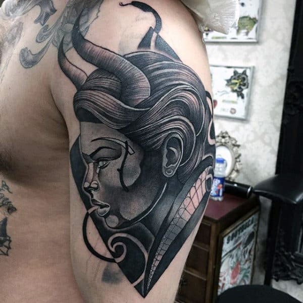 Profile View Of Horned Man Male Arms Tattos