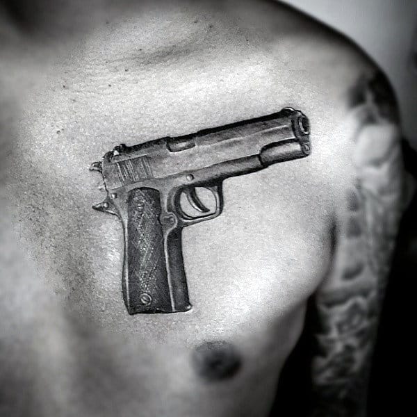 Protruding Pistol Tattoo On Chest For Male