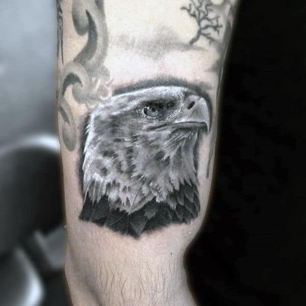 Proud American Eagle Hawk Head Tattoo On Upper Arm On Man