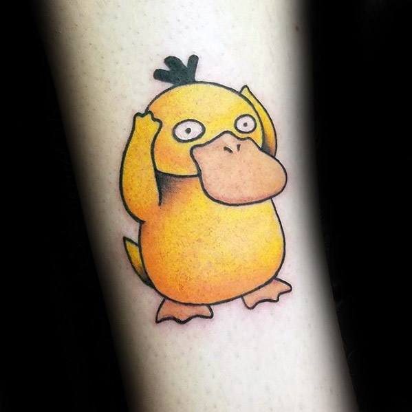 Bright and clean Psyduck tattoo with a classic confused pose, inked on a man's leg with subtle shading and soft outlines.