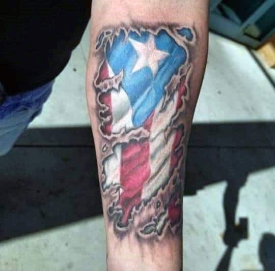 Puerto Rican flag tattoo with a ripped skin effect, revealing vibrant red, white, and blue colors with a bold star underneath.