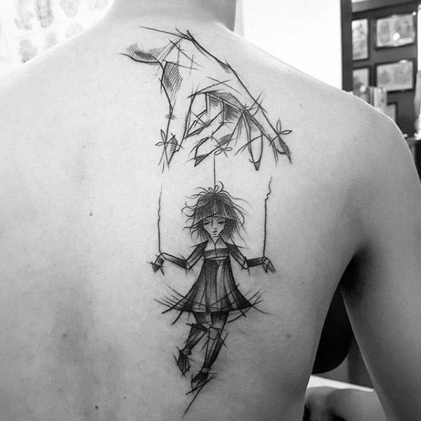 Sketch-style puppet tattoo of a messy-haired girl marionette controlled by a large hand, symbolizing fragility, control, or emotional struggle.