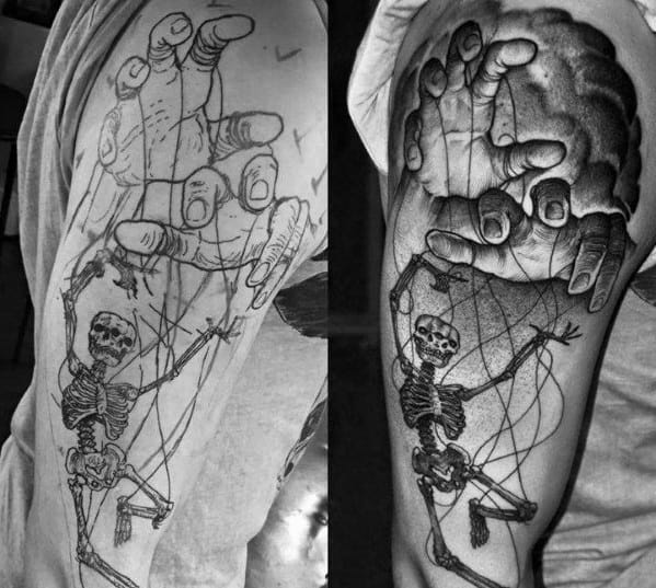 Detailed black and grey puppet tattoo of a large hand controlling a skeleton with strings, symbolizing manipulation, mortality, and fate.