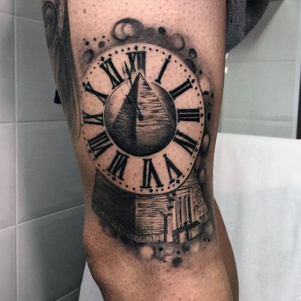 Pyramid With Roman Numeral Clock Tattoo On Guys Thigh