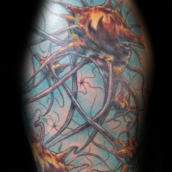 Vibrant neuron tattoo with fiery orange cell bodies, dynamic axons, and a glowing blue background for a bold, energetic design.