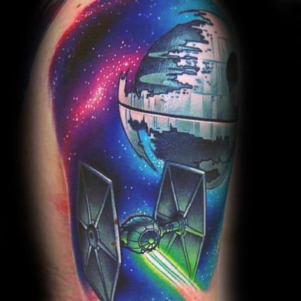 Colorful tattoo of the Death Star with a TIE fighter, set against a vibrant cosmic galaxy backdrop
