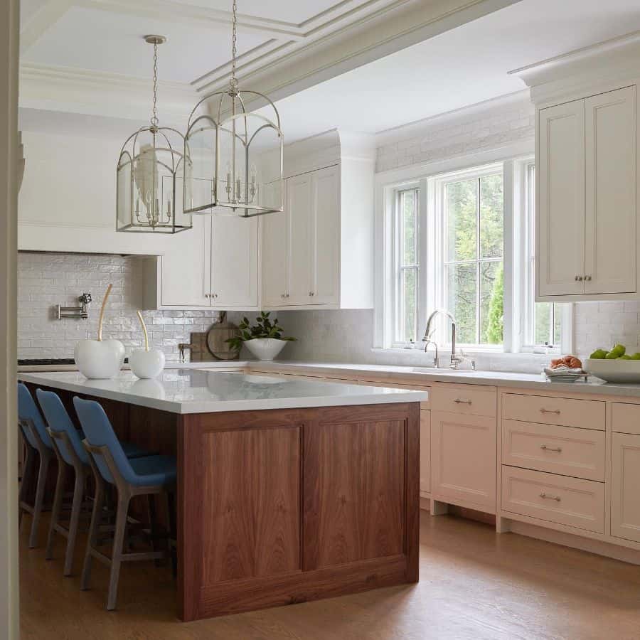 country style kitchen white cabinets wood island three blue chairs white countertop