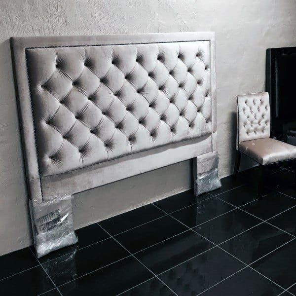 queen size gray headboard black floor tiles