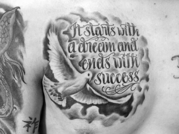 Chest tattoo featuring a white dove flying through clouds with the quote “It starts with a dream and ends with success” in cursive script.