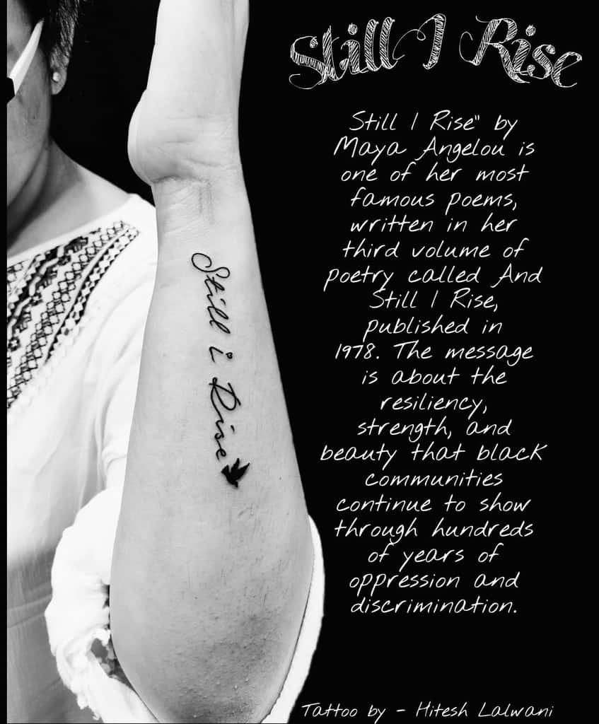 Arm with "Still I Rise" tattoo