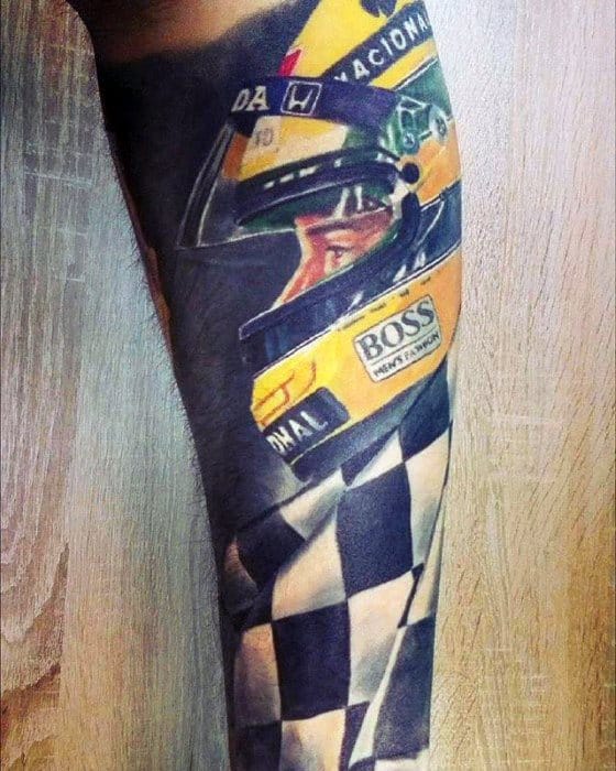 Vibrant tattoo of a Formula 1 driver in a yellow helmet with sponsor logos, paired with a waving checkered flag symbolizing victory and speed.