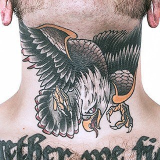 Throat tattoo featuring a fierce eagle in mid-dive with outstretched wings, sharp talons, and bold black and gold shading