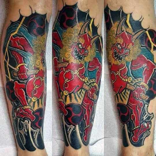 Bold Raijin leg tattoo with fierce red thunder god, golden curls, lightning bolts, and dark swirling clouds in traditional Japanese style.