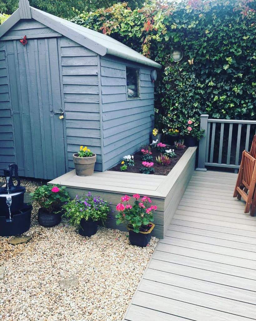raised flower bed flowers wood shed wood deck