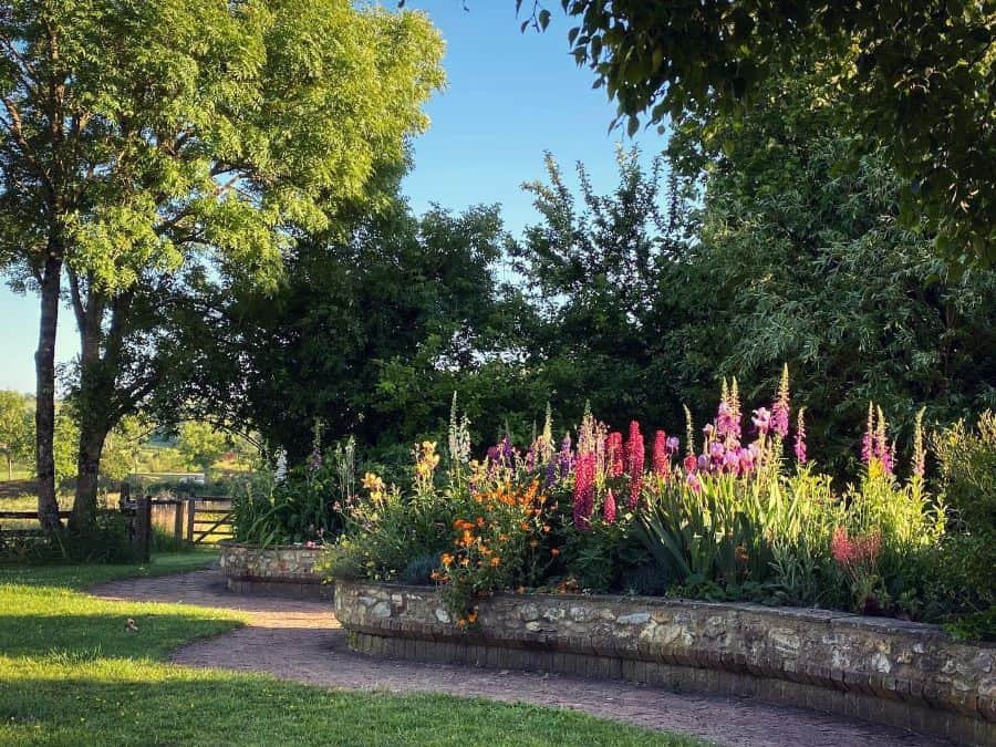large raised flower bed country home