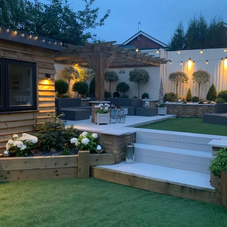 modern backyard wood gazebo raised flower beds gray outdoor furniture