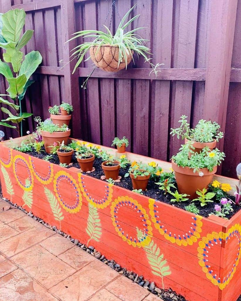 colorful raised flower bed backyard fence
