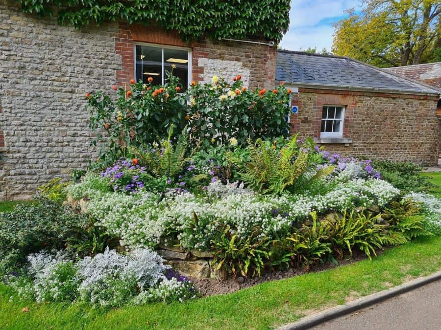 large raised flower bed brick house