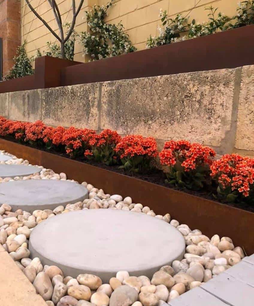 raised garden edging garden red flowers