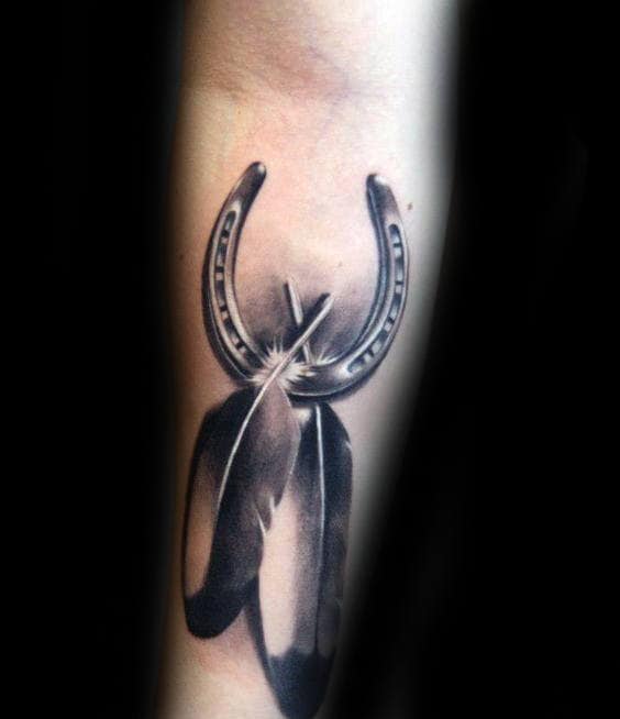 Realistic 3d Horseshoe With Feathers Mens Inner Forearm Tattoo