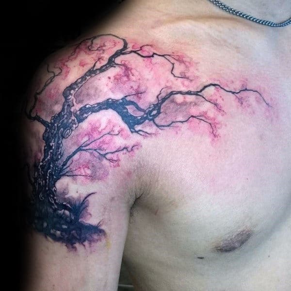 Cherry blossom tree tattoo on the shoulder, featuring dark twisted branches and soft pink watercolor-style blossoms for a bold yet delicate look