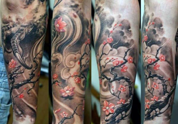 Japanese-style forearm sleeve tattoo featuring cherry blossom branches, swirling clouds, and a dragon claw for a dramatic, artistic look
