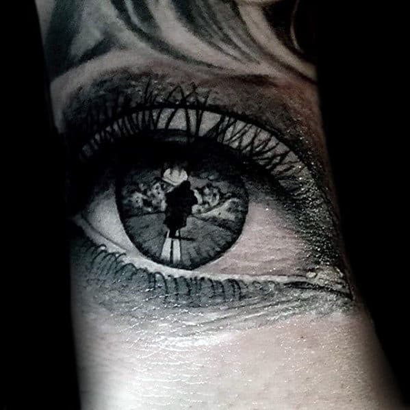 Realistic Eye With Motorcycle Rider Design Tattoo For Men